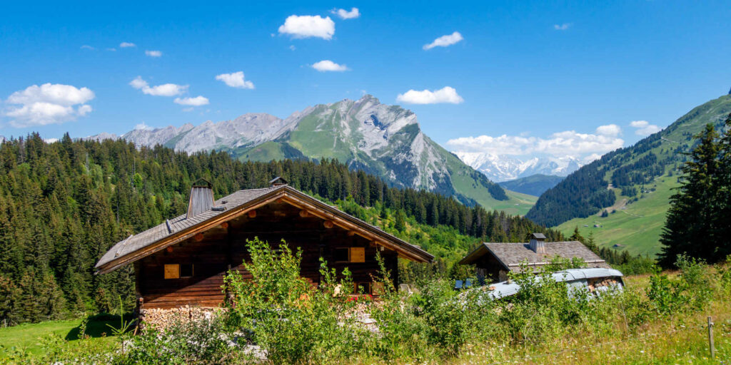 Chalet in mountain landscape and Mont Blanc view, La Clusaz, France