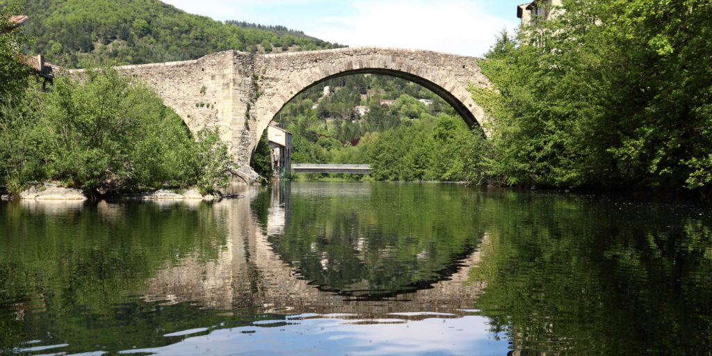 old bridge over the river in Le Vigan, France